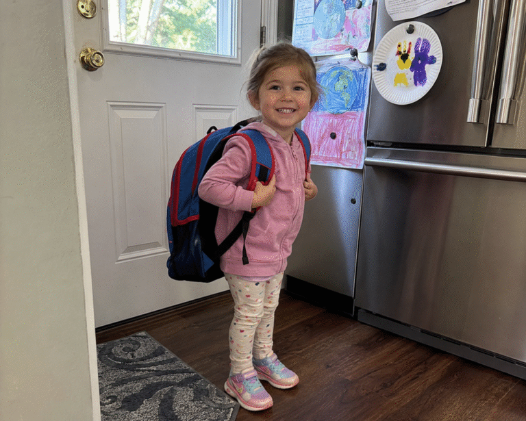Preschool child wearing a backpack, ready for back to school readiness